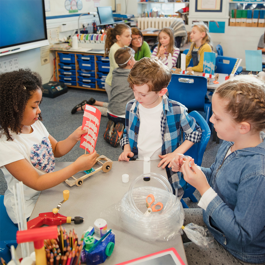 mission image Children at a table in a classroom